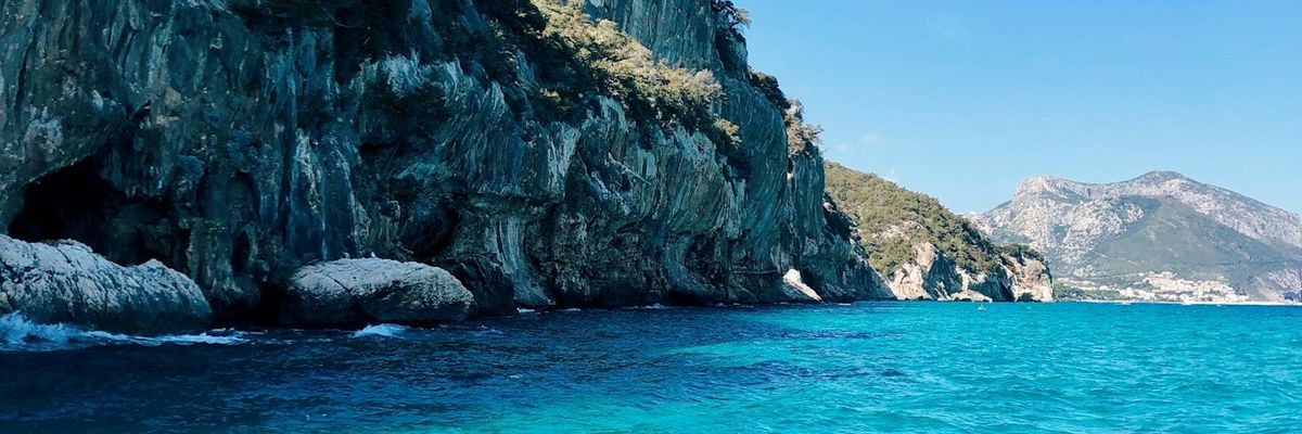 Turquoise sea under the cliffs at Cala Luna, Sardinia
